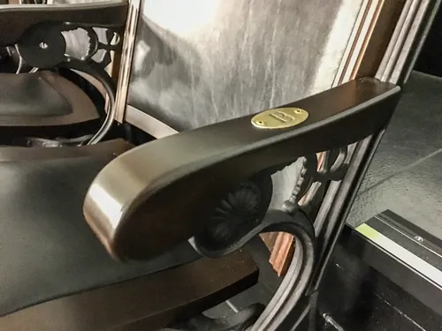 Theatre seat arm, refinished