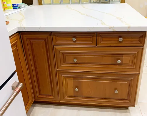 Cabinetry refinished, marble top